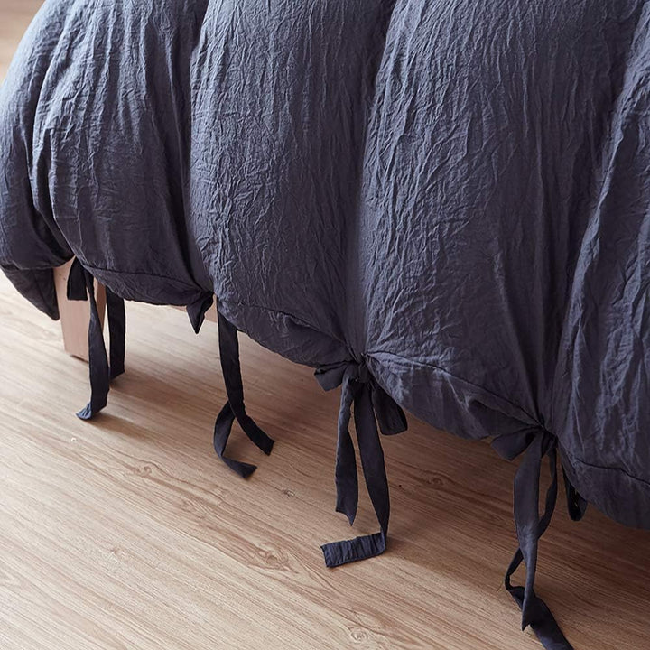 Close-up of the knot ends on the navy blue duvet cover from the VibeCore Aesthetic Knot So Ordinary Duvet Cover Set, highlighting the chic knot detail that adds a modern, stylish flair to your bedding.