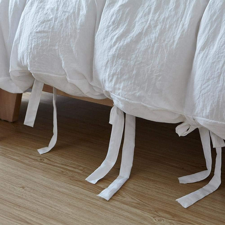 Close-up of the knot ends on the white duvet cover from the VibeCore Aesthetic Knot So Ordinary Duvet Cover Set, highlighting the chic knot detail that adds a modern, stylish flair to your bedding.