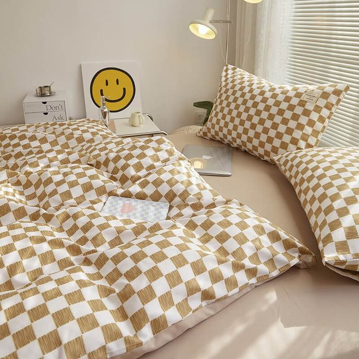 Alternate close-up side view of the 'VibeCore Aesthetic Mini Checkered Duvet Cover Set' in Brown, highlighting the detailed checkered pattern and soft, high-quality fabric. The modern design adds a fresh, stylish touch to any bedroom or dorm, offering both comfort and contemporary flair.