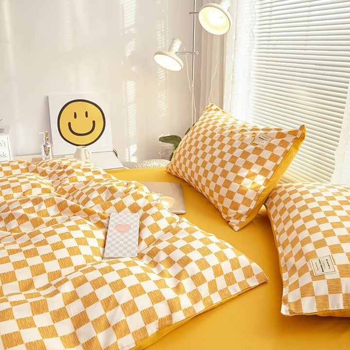 Close-up of the right side, demonstrating the checkered pattern on the 'VibeCore Mini Checkered Bedding Set' in Mustard Yellow. The modern, sleek design of the mini checkers enhances the stylish, cozy feel of the bedding, perfect for adding a fresh, contemporary vibe to your space.