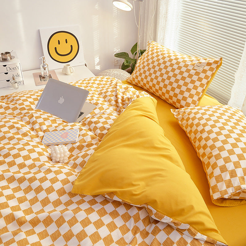 Close-up side view demonstrating the interior of the duvet cover and checkered pattern of the 'VibeCore Mini Checkered Bedding Set' in Mustard Yellow. The soft, high-quality fabric features a modern, sleek mini checkered design, adding a bold, contemporary touch to the cozy bedding.
