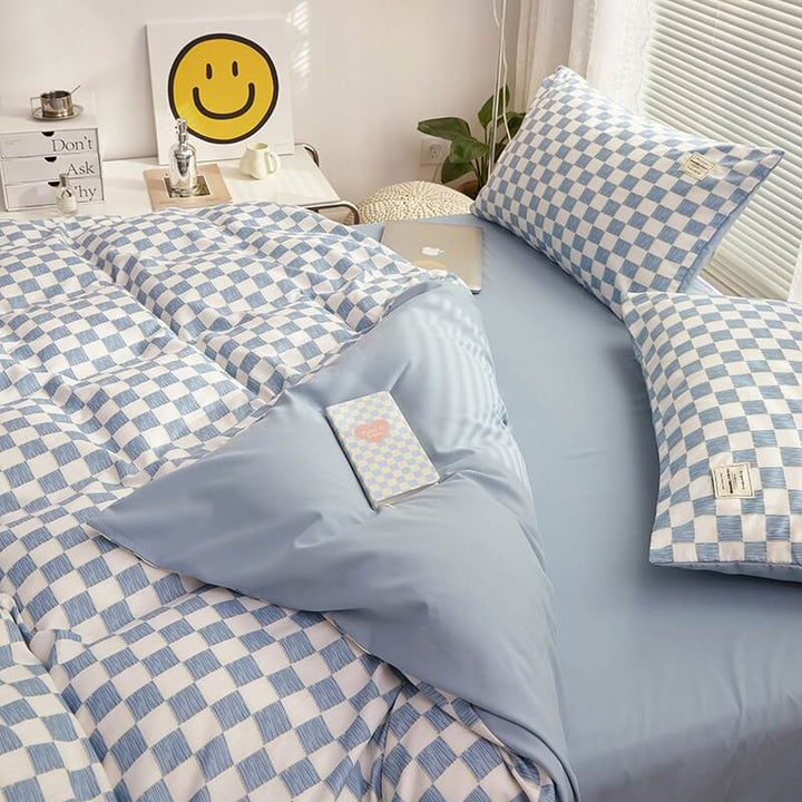 Alternate close-up side view of the 'VibeCore Aesthetic Mini Checkered Duvet Cover Set' in Sky Blue, highlighting the detailed checkered pattern and soft, high-quality fabric. The modern design adds a fresh, stylish touch to any bedroom or dorm, offering both comfort and contemporary flair.