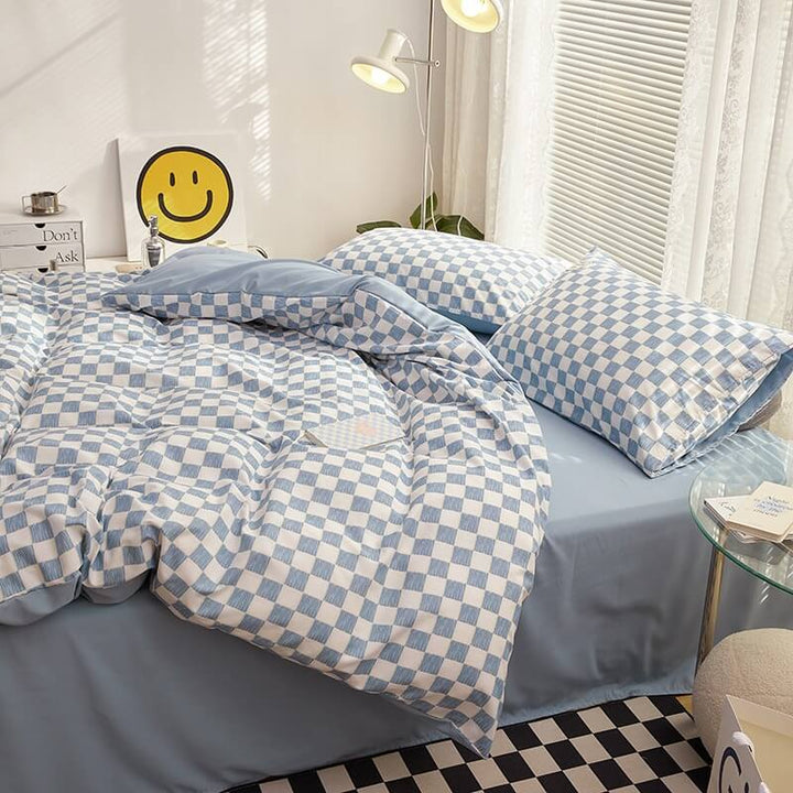 Side right view of the 'VibeCore Mini Checkered Bedding Set' in Sky Blue, showcasing the sleek, modern checkered pattern. The soft fabric and trendy design create a stylish and comfortable vibe, making it a perfect addition to any bedroom or dorm.