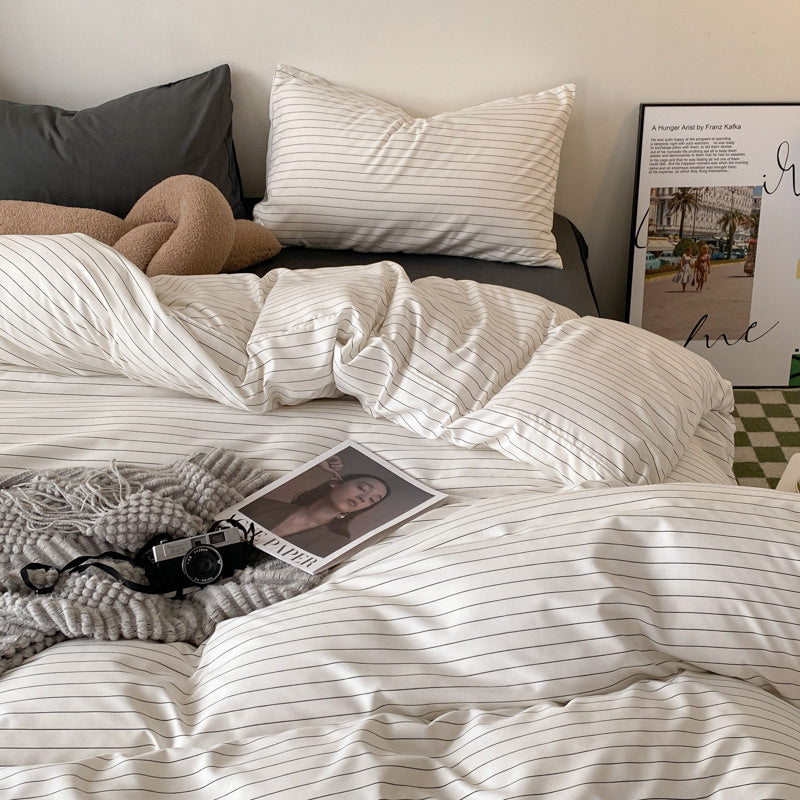 Aerial close-up of the VibeCore Aesthetic Modern Stripe Duvet Cover Set, showcasing the sleek, contemporary striped design and soft, breathable fabric. A stylish and cozy addition to any bedroom or dorm, offering a modern touch with ultimate comfort.