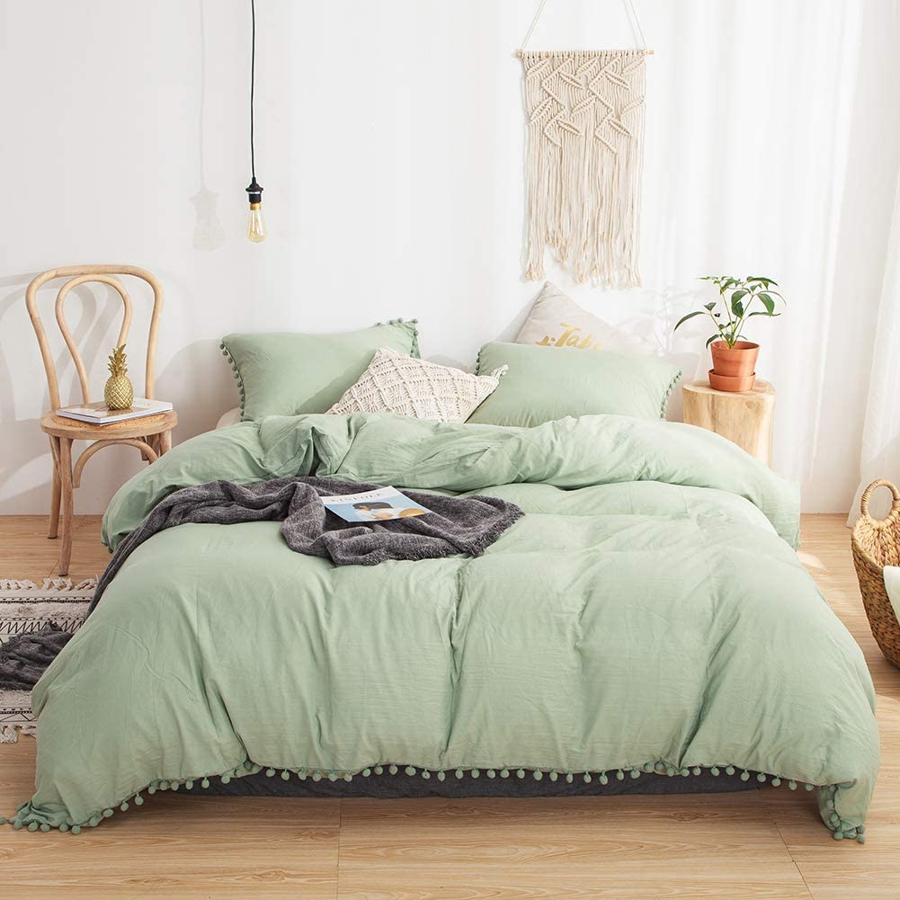 Aerial view of the VibeCore Aesthetic PomPom Duvet Cover Set in pastel green, featuring soft pom-pom accents that add a playful and cozy touch. Crafted from soft, breathable fabric, this duvet set brings a fresh, light, and inviting aesthetic to any bedroom or dorm.