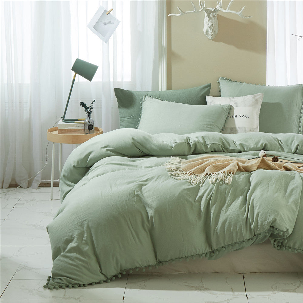Left front view of the VibeCore Aesthetic PomPom Duvet Cover Set in pastel green, featuring soft pom-pom accents that add a playful and cozy touch. Made from soft, breathable fabric, this duvet set brings a light, fresh vibe to any bedroom or dorm.