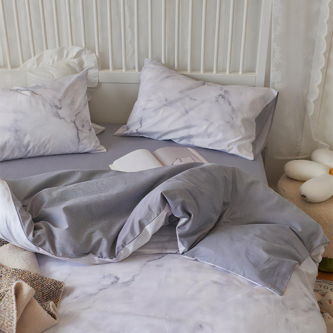 Aerial view of the VibeCore Aesthetic Purple Marble Duvet Cover Set, featuring a striking purple marble design with intricate swirls and rich tones. Crafted from soft, breathable fabric, this duvet cover set adds a modern, luxurious touch to any bedroom or dorm.