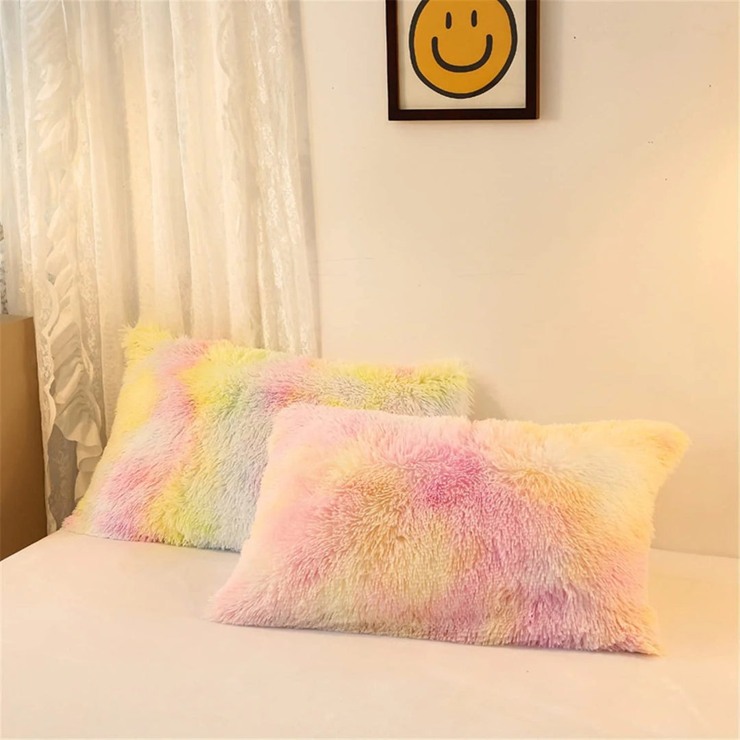 Close-up of pillowcases from the VibeCore Rainbow Fluffy Bedding Set in a gradient soft pink and yellow Ice Cream color, made with ultra-soft plush fabric that adds cozy luxury to your bedroom or dorm. The pastel Ice Cream color complements the vibrant bedding set, creating a playful and soothing atmosphere with plush comfort.