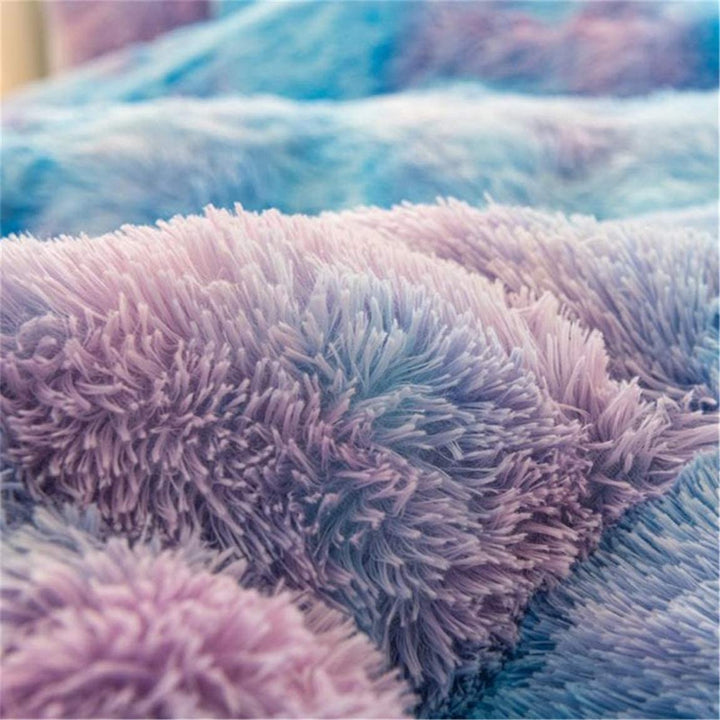 Close-up of the ultra-soft plush material used in the VibeCore Rainbow Fluffy Bedding Set in blue and purple Mystic color, highlighting its luxurious texture for a cozy, comfortable sleep experience. The plush fabric adds warmth and a premium feel, perfect for elevating your bedroom or dorm with vibrant color and comfort.