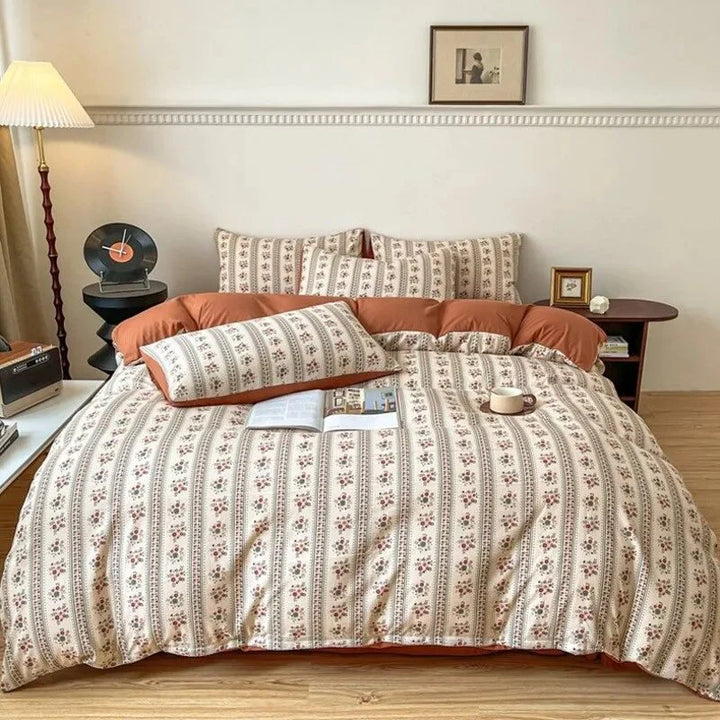 Aerial view of the VibeCore Aesthetic Retro Terracotta Floral Duvet, showcasing the rich terracotta color and intricate floral design. Crafted from soft, breathable fabric, this duvet brings a cozy, vintage-inspired charm to any bedroom or dorm.