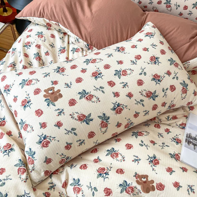 Close-up of the pillowcase from the VibeCore Aesthetic Rosy Bear Duvet Cover Set, featuring the cute rosy bear design and soft, pastel hues. Made from breathable, cozy fabric, this pillowcase adds a playful and cozy touch to any bedroom or dorm.