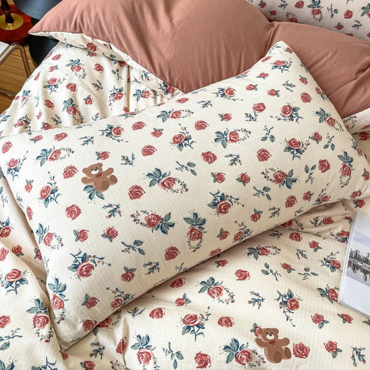 Close-up of the pillowcase from the VibeCore Aesthetic Rosy Bear Duvet Cover Set, featuring the cute rosy bear design and soft, pastel hues. Made from breathable, cozy fabric, this pillowcase adds a playful and cozy touch to any bedroom or dorm.