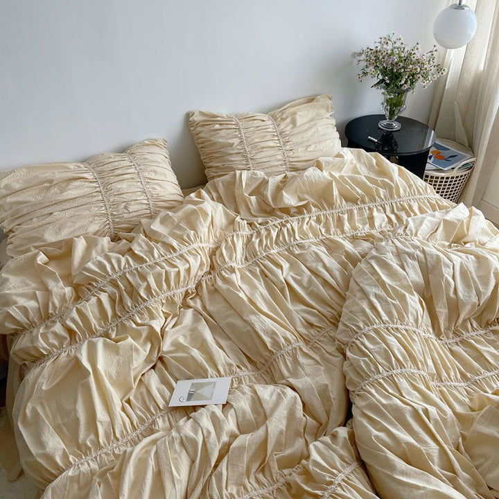 Close-up aerial view of the VibeCore Royal Pleated Bedding Set, highlighting the intricate pleated details and luxurious 100% cotton fabric, offering a soft and chic addition to any bedroom or dorm.