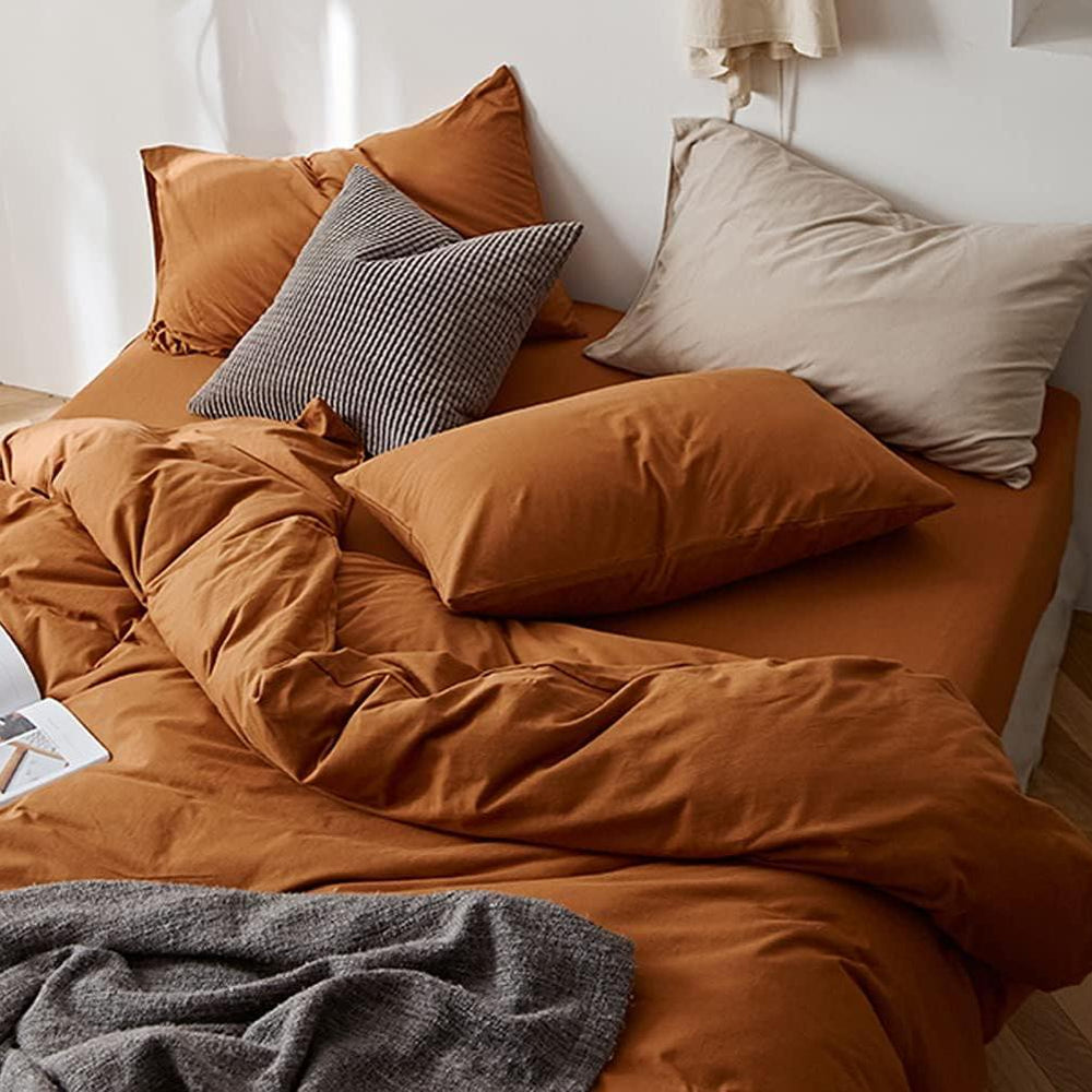 Aerial close-up of the VibeCore Aesthetic Solid Comfort Duvet Cover Set in Burnt Orange, showcasing the soft, premium texture and vibrant hue that brings warmth and sophistication to any space.