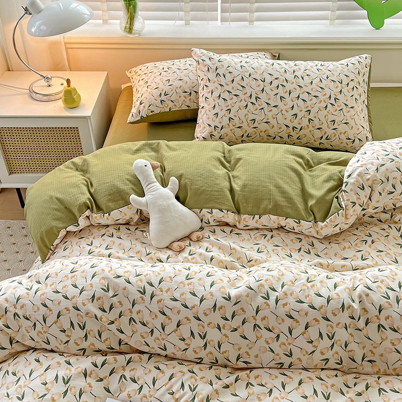 Aerial close-up of the VibeCore Aesthetic Tulip Meadow Duvet Cover Set, showcasing the vibrant tulip design with soft, pastel hues. Made from breathable, cozy fabric, this duvet set brings a fresh and floral touch to any bedroom or dorm decor.