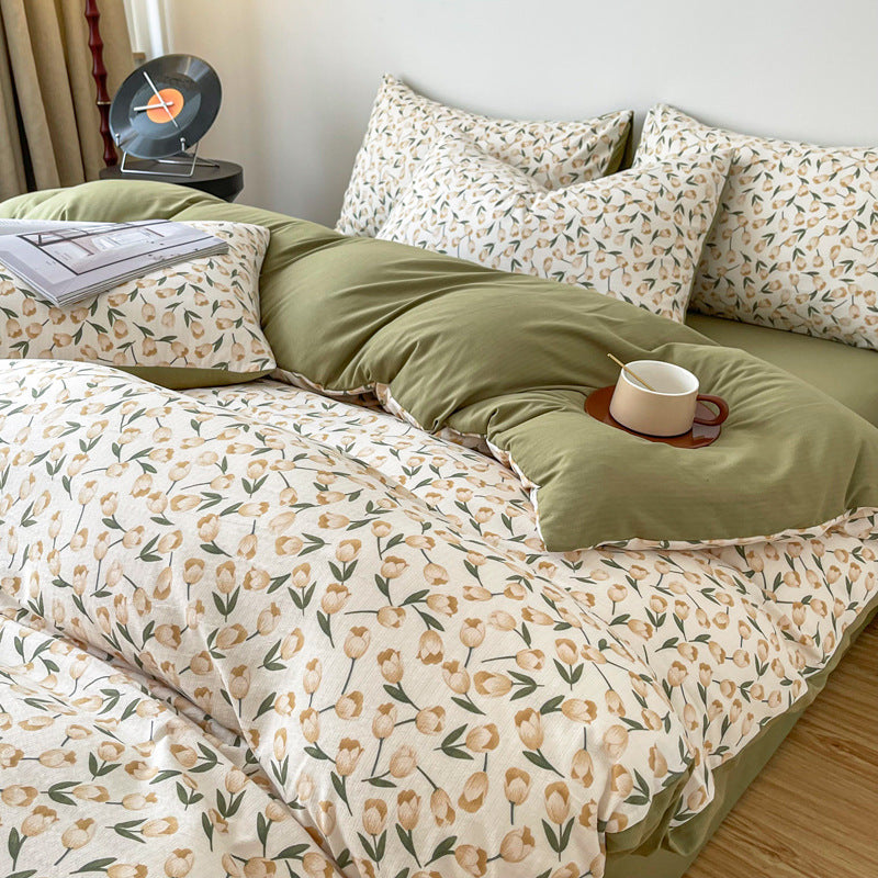 Close-up view of the VibeCore Aesthetic Tulip Meadow Duvet Cover Set, featuring a delicate tulip design in soft, vibrant colors. Made from breathable, cozy fabric, this duvet cover adds a fresh, floral touch to any bedroom or dorm decor.