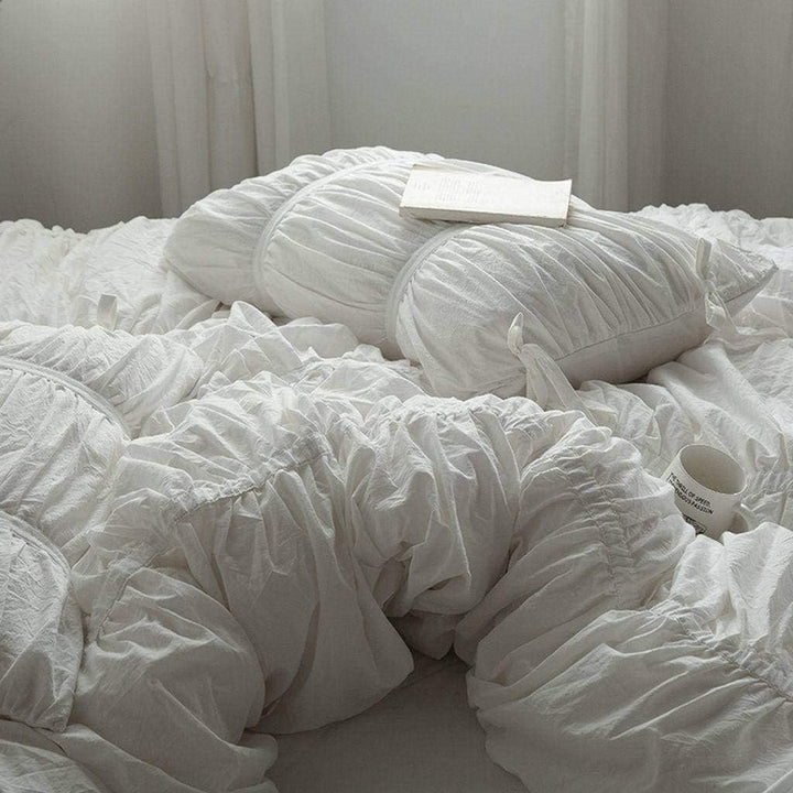 Close-up view showcasing the intricate detailing of the VibeCore White Timeless Elegance Pleated Bedding Set, highlighting its elegant pleats and luxurious fabric.