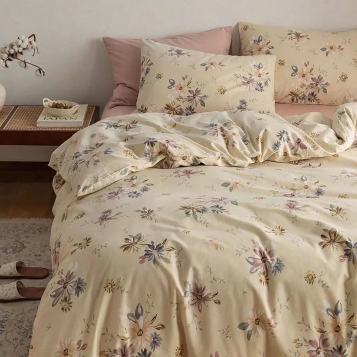 Close-up aerial view of the VibeCore Aesthetic Wildflower Whisper Duvet Cover, showcasing its delicate wildflower pattern in soft, muted colors, creating a peaceful, nature-inspired atmosphere perfect for adding subtle charm to any bedroom or dorm.