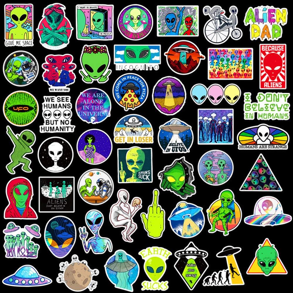 VibeCore Alien Stickers laid out, showcasing a variety of cosmic designs including aliens, UFOs, and intergalactic symbols, perfect for adding a sci-fi vibe to your belongings.