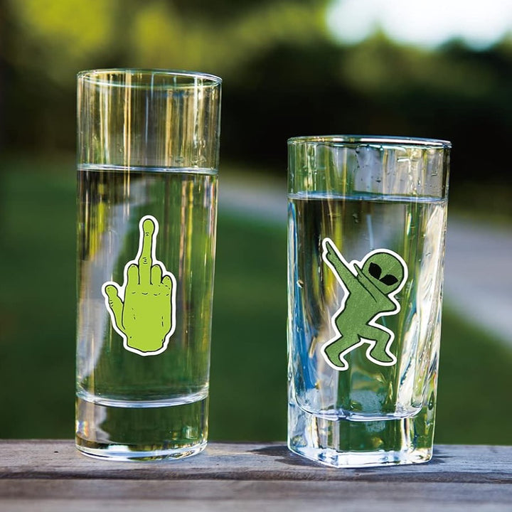 VibeCore Alien Stickers applied to glass, featuring playful alien and UFO designs, bringing a fun, futuristic touch to your space with a cosmic vibe.