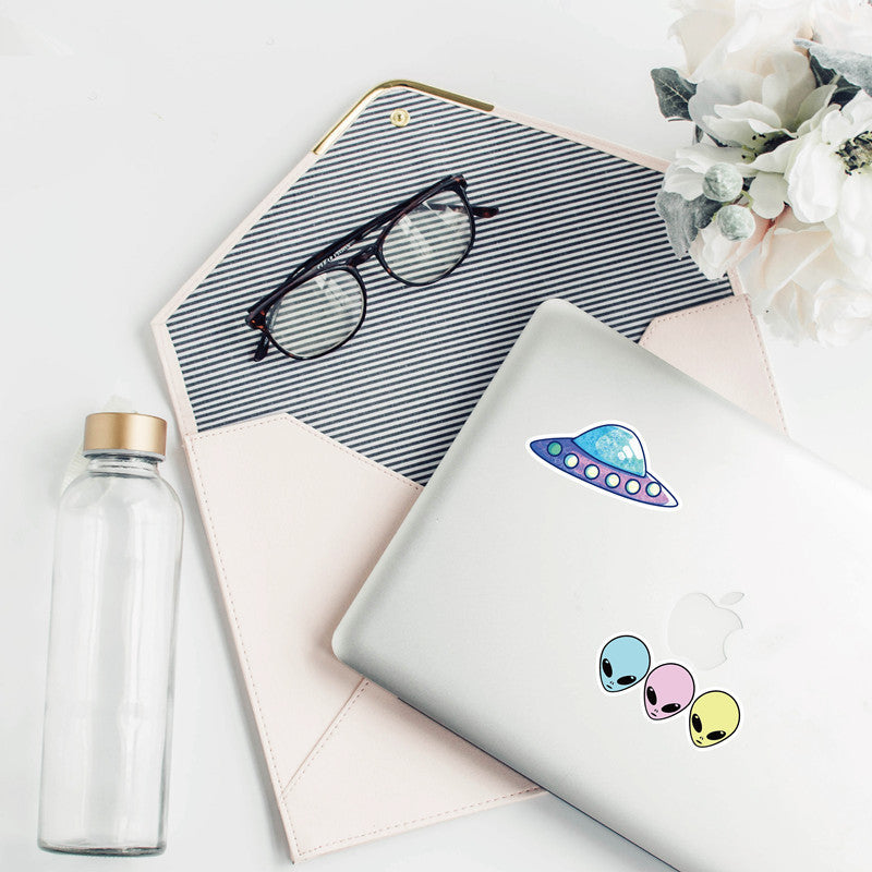 VibeCore Alien Stickers applied to a laptop, featuring quirky alien and UFO designs, adding a fun, futuristic touch to your tech accessories.