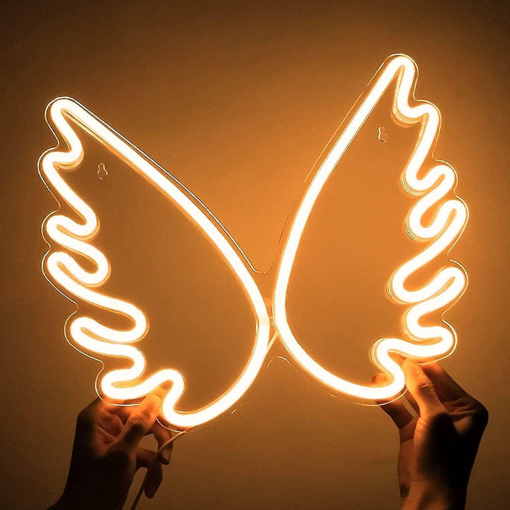 VibeCore Angel Wings Neon Light Warm White Being Held Up