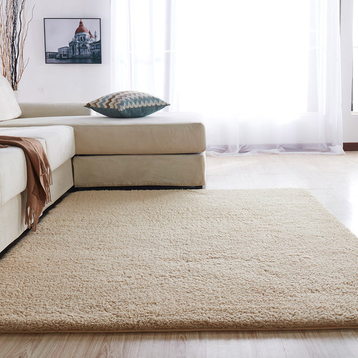 VibeCore Arctic Faux Cashmere Area Rug in beige, made from soft faux cashmere for a plush feel. Non-slip backing for safety, ideal for bedrooms, living rooms, or dorms. Durable, easy to clean, and available in 11 color options.
