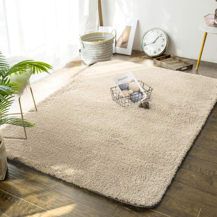 VibeCore Arctic Faux Cashmere Area Rug in beige on the floor, showcasing its soft faux cashmere texture and non-slip backing. Adds a cozy, luxurious touch to any room. Durable, easy to clean, and available in 11 color options.