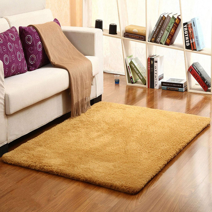 VibeCore Arctic Faux Cashmere Area Rug in khaki placed in a living room, featuring a soft faux cashmere texture with non-slip backing. Adds warmth and luxury to any space, perfect for enhancing comfort and style. Easy to clean and available in 11 color options.