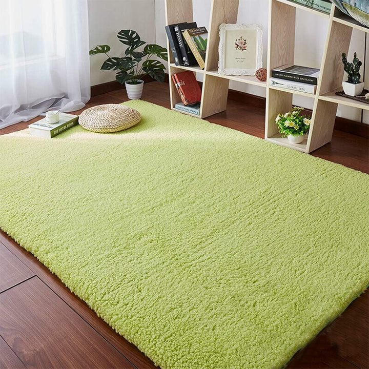 VibeCore Arctic Faux Cashmere Area Rug in matcha green on the floor, showcasing its soft faux cashmere texture and non-slip backing. Adds a cozy, luxurious touch to any room. Durable, easy to clean, and available in 11 color options.