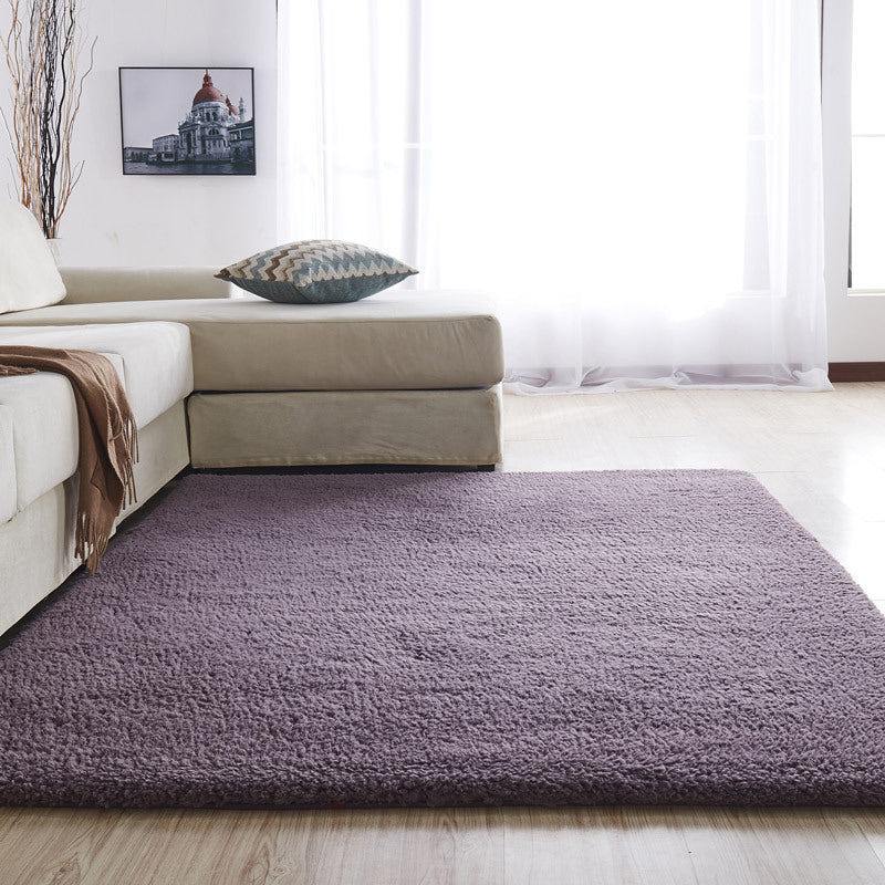 VibeCore Arctic Faux Cashmere Area Rug in purple gray, made from soft faux cashmere for a plush feel. Non-slip backing for safety, ideal for bedrooms, living rooms, or dorms. Durable, easy to clean, and available in 11 color options.