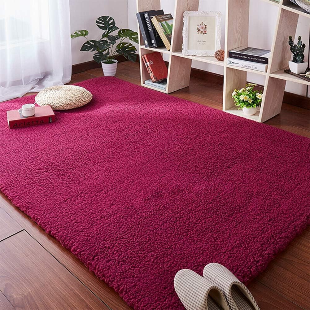 VibeCore Arctic Faux Cashmere Area Rug in red wine on the floor, showcasing its soft faux cashmere texture and non-slip backing. Adds a cozy, luxurious touch to any room. Durable, easy to clean, and available in 11 color options.
