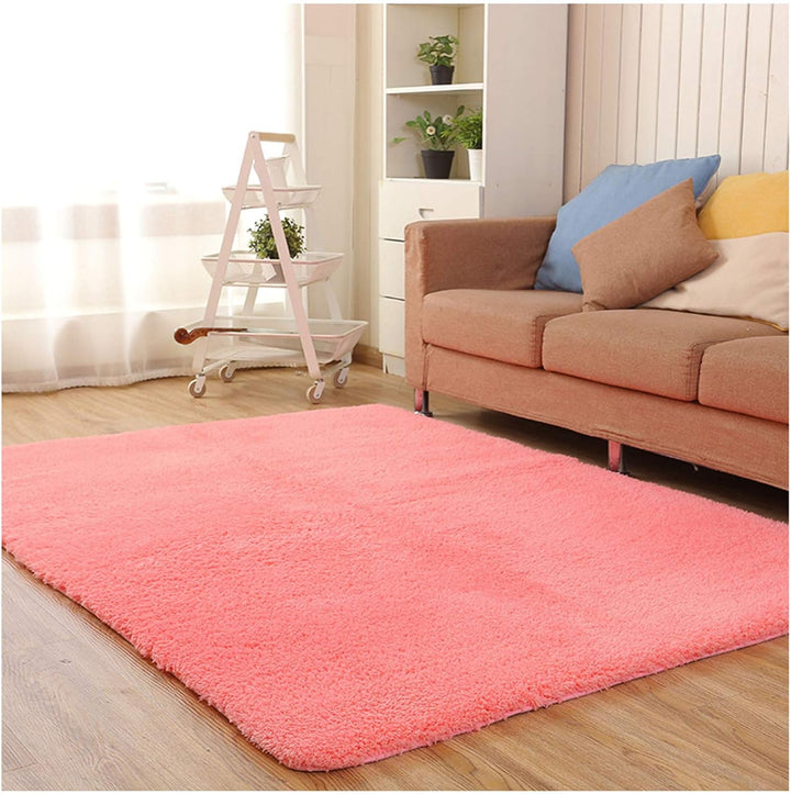 VibeCore Arctic Faux Cashmere Area Rug in watermelon pink, made from soft faux cashmere for a plush feel. Non-slip backing for safety, ideal for bedrooms, living rooms, or dorms. Durable, easy to clean, and available in 11 color options.
