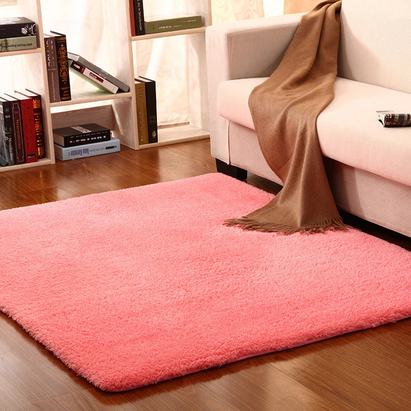 VibeCore Arctic Faux Cashmere Area Rug in watermelon pink on the floor, showcasing its soft faux cashmere texture and non-slip backing. Adds a cozy, luxurious touch to any room. Durable, easy to clean, and available in 11 color options.