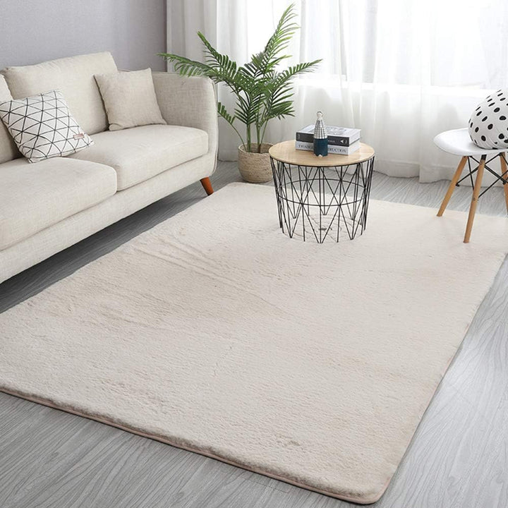 VibeCore Arctic Faux Cashmere Area Rug in white, made from soft faux cashmere for a plush feel. Non-slip backing for safety, ideal for bedrooms, living rooms, or dorms. Durable, easy to clean, and available in 11 color options.