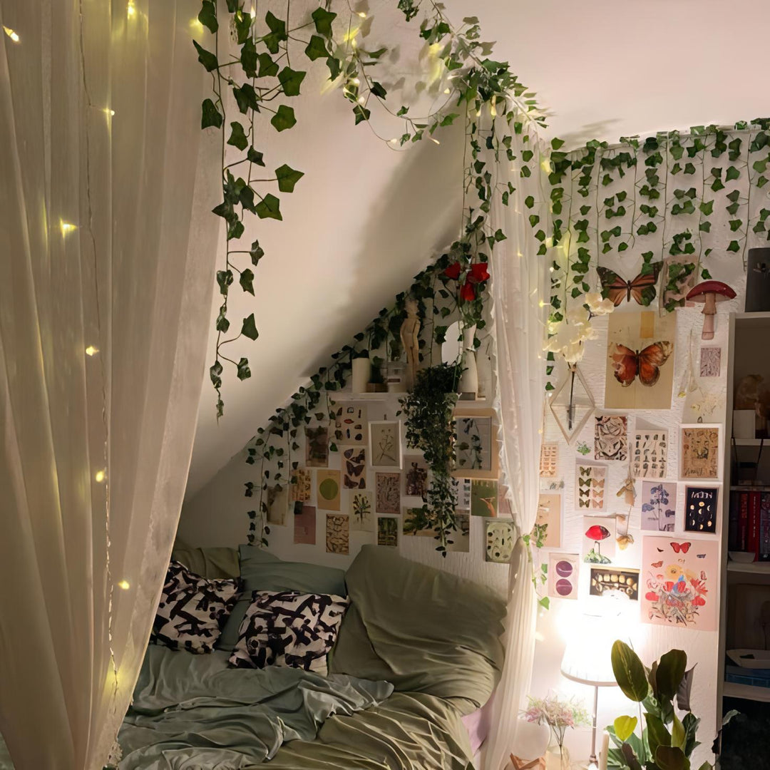 VibeCore Artificial Vine Garland Bundle in a cottagecore teen room, featuring lush fake ivy vines that add vibrant greenery and a cozy, natural atmosphere. Perfect for draping along walls, furniture, or ceilings, these flexible, low-maintenance vines bring a whimsical touch to the room's decor.