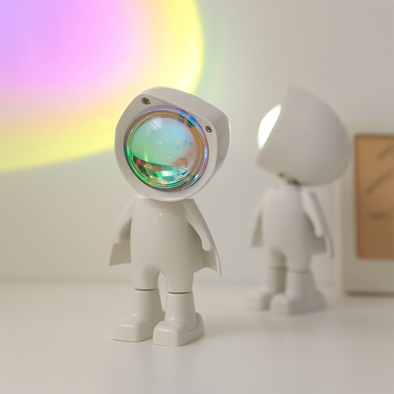 Astronaut Sunset Light with a futuristic design, featuring 360° adjustability, warm sunset hues, and stepless dimming. This USB-powered lamp comes in Rainbow and Twilight options, perfect for aesthetic, cutecore, coquette, teen rooms, dorm rooms, celestial decor, mood lighting, and cozy spaces.