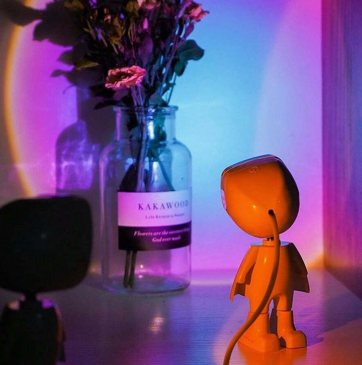 Close-up of the VibeCore Astronaut Sunset Light in Twilight color, showcasing its futuristic design, warm sunset hues, and adjustable projection. This USB-powered lamp is perfect for aesthetic, cutecore, coquette, teen rooms, dorm rooms, celestial decor, mood lighting, and cozy spaces.