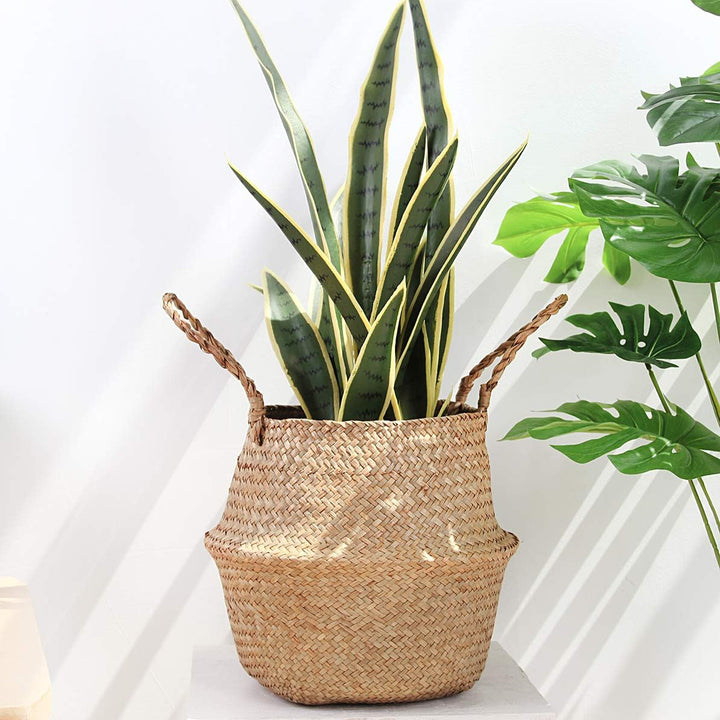 VibeCore BONO Handmade Wicker Basket with flowers, showcasing its handwoven organic wicker design. A stylish decorative planter or storage piece, adding a natural, boho-inspired touch to any space.