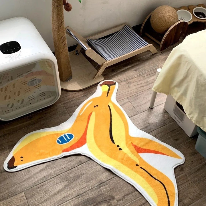 VibeCore Banana Peel Accent Rug on a bedroom floor, featuring its playful yellow hue, quirky banana peel design, soft plush texture, non-slip backing, and vibrant aesthetic. A fun, bold rug that adds personality and comfort to modern bedroom, dorm, or living room decor.