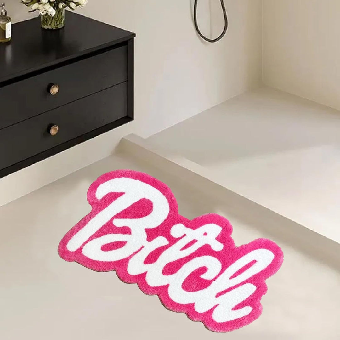VibeCore Barbie Bitch Accent Rug in front of shower, showcasing a vibrant pink design with a bold message, perfect for adding personality and comfort to your bathroom space.