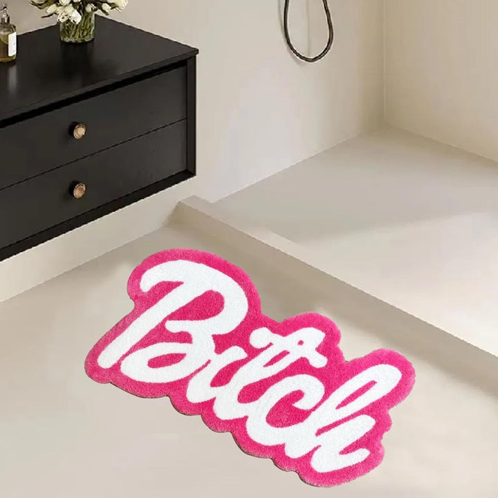VibeCore Barbie Bitch Accent Rug in front of shower, showcasing a vibrant pink design with a bold message, perfect for adding personality and comfort to your bathroom space.