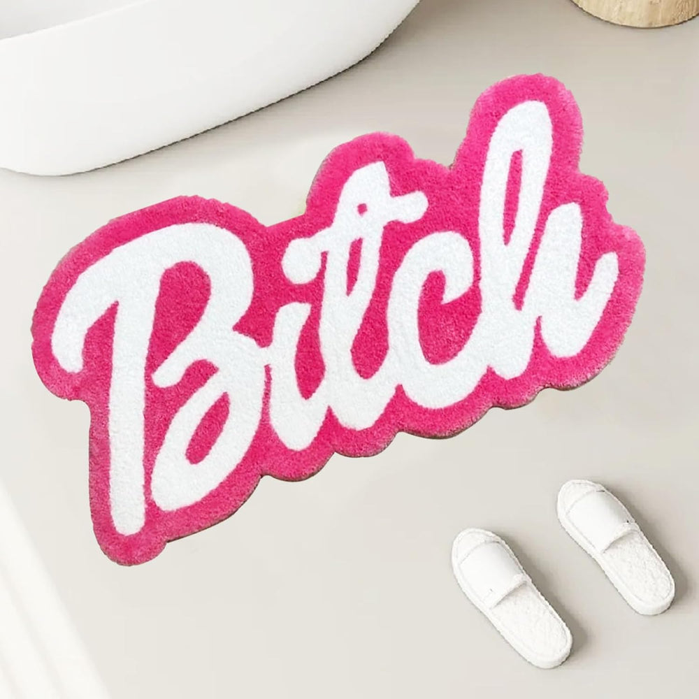 VibeCore Barbie Bitch Accent Rug in front of tub, featuring a bold pink design and plush texture, adding a touch of sassy flair to your bathroom.