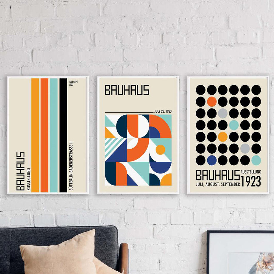 VibeCore Bauhaus Abstract Canvas Posters displayed as a set of 3 on the wall, featuring minimalist geometric designs inspired by Bauhaus and Nordic aesthetics. Modern, sleek wall art with vibrant colors and a semigloss finish. Ideal for adding a sophisticated, contemporary touch to bedrooms, dorms, or apartments.