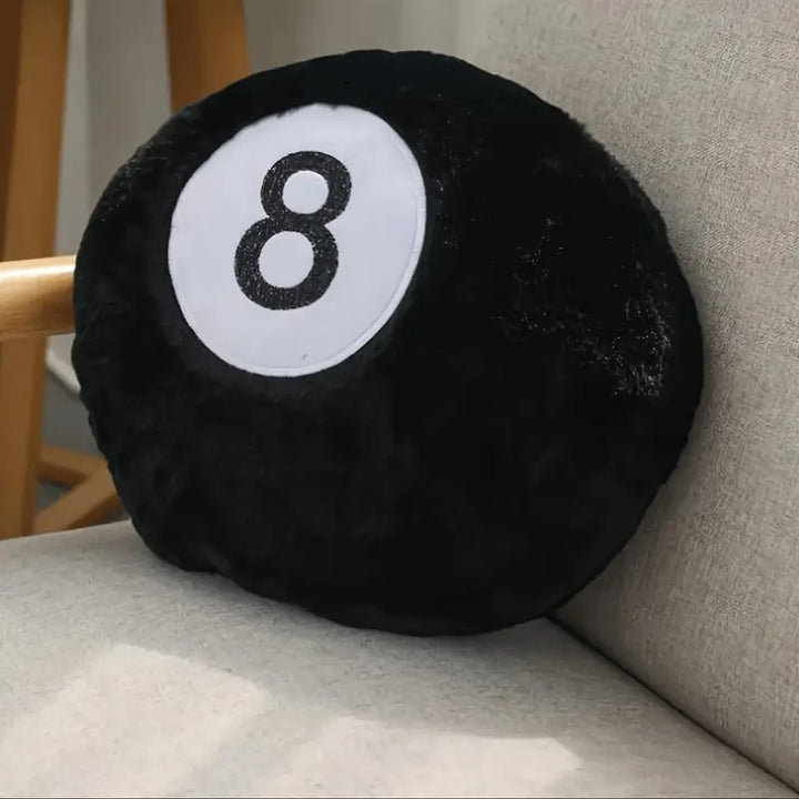 VibeCore Billiard Ball Throw Pillow featuring bold magic 8 ball design, placed on a chair. Soft, plush fabric offering comfort and a playful, trendy vibe to any room, perfect for game rooms, dorms, or bedrooms.