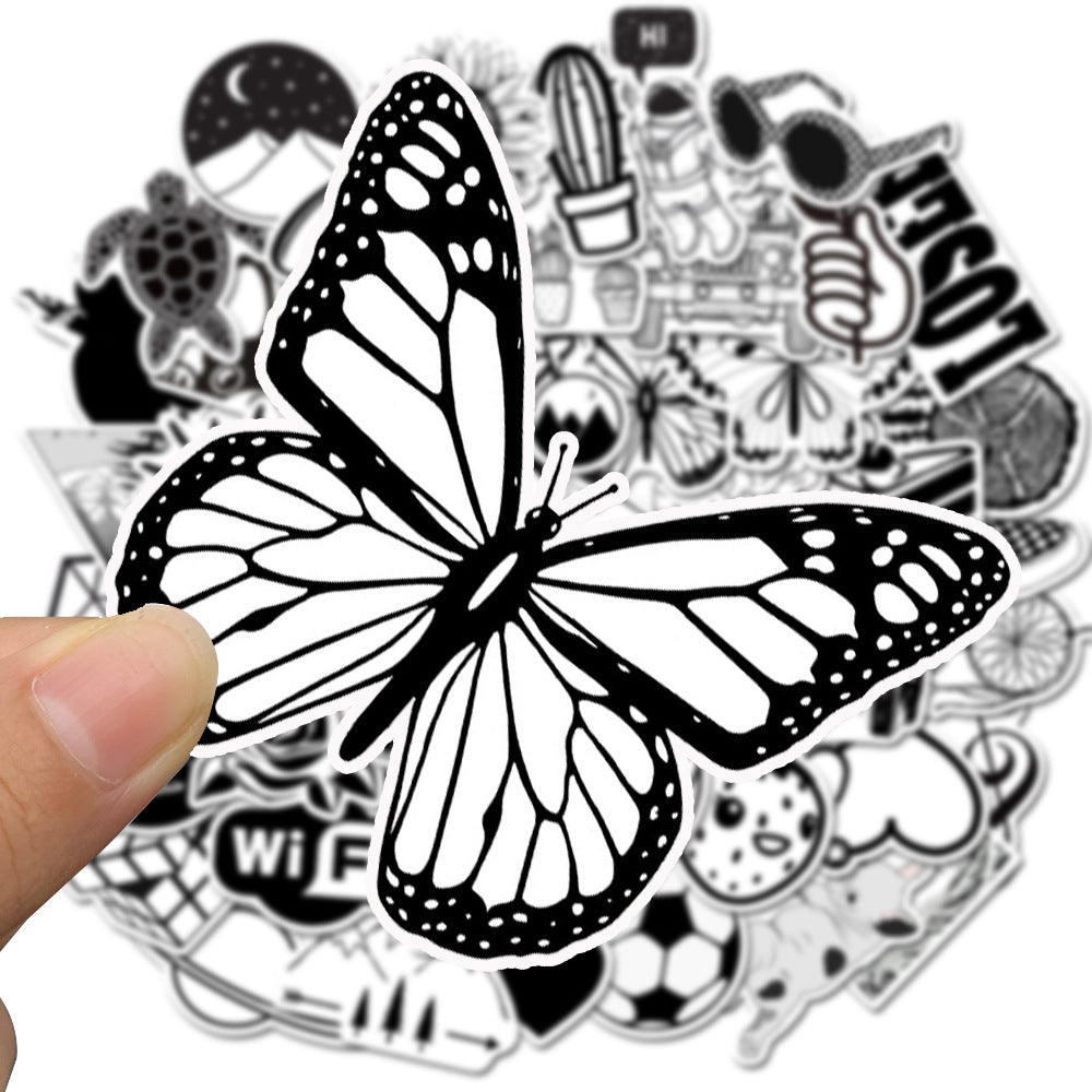 Close-up of a VibeCore Black and White Sticker featuring a minimalist butterfly design, adding a sleek, modern touch to your accessories with a timeless monochrome aesthetic.
