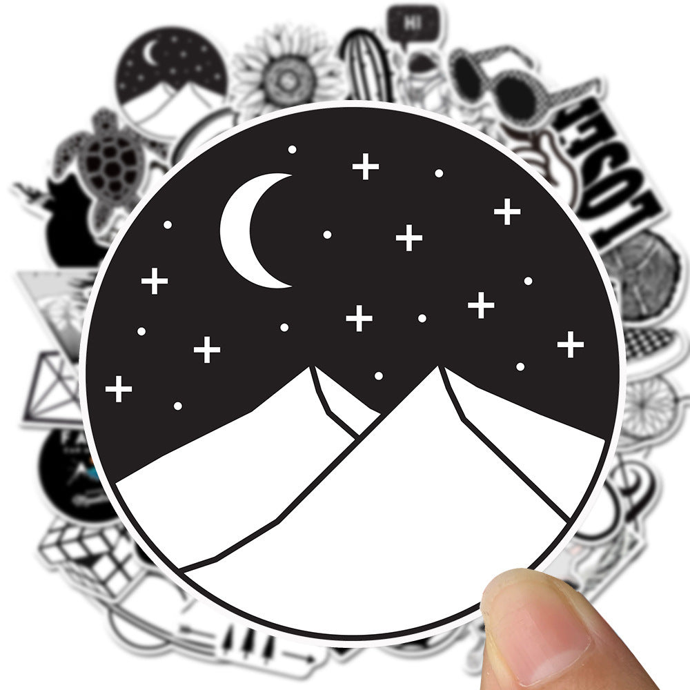 Close-up of a VibeCore Black and White Sticker depicting a night scene over mountains, featuring a minimalist design with a sleek, monochrome aesthetic.