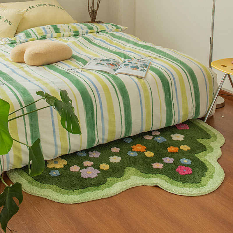 VibeCore Blooming Garden Accent Rug at the foot of a bed, featuring a vibrant floral pattern with green and colorful tones, perfect for nature-inspired bedroom decor.