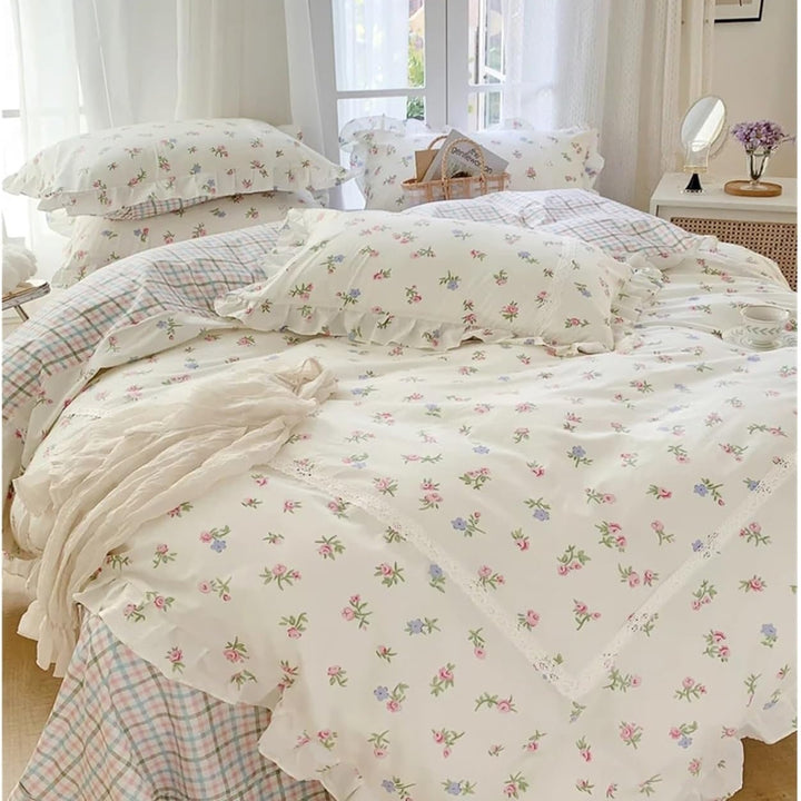 VibeCore Blossom French Ruffles Duvet Cover Set by window, angled front view, showcasing soft cotton fabric, delicate ruffles, and a romantic floral design for a cozy, elegant bedroom.