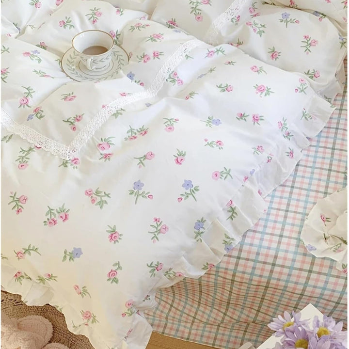 VibeCore Blossom French Ruffles Duvet Cover Set by window, close-up showcasing soft cotton texture, delicate French ruffles, and elegant floral details.